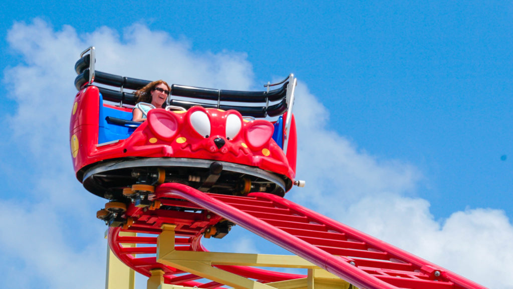 A woman riding the Crazy Mouse rollercoaster