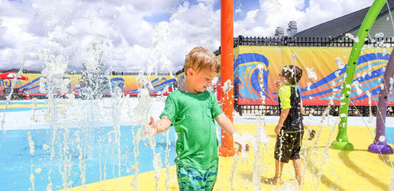 Children playing with jets of water in the Wacky Waters splash pad